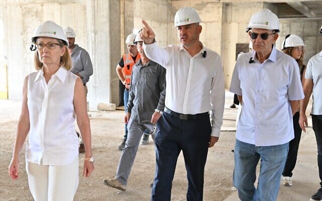 From left to right, Anat Harlap, Rabin Medical Center Deputy CEO Liron Goldenberg, and Dr. Shmuel Harlap visit construction site of Rabin Medical Center's new 'Tower of Hope' in an undated photo (Courtesy/Elad Gutman)