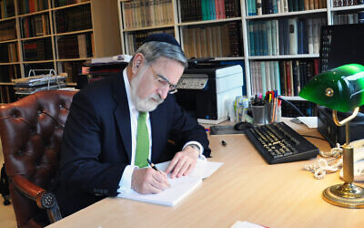 Rabbi Jonathan Sacks in his study in an undated photo (Koren Publishers)