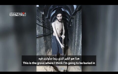 Hamas-held hostage Evyatar David filmed digging what he says he fears will be his own grave in a tunnel in Gaza, in a Hamas propaganda video that his family cleared for publication on August 2, 2025.