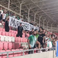 Maccabi Haifa fans display banner reading "Murderers since 1939" at match against a Polish club in Hungary, August 15, 2025. (Screenshot/X)