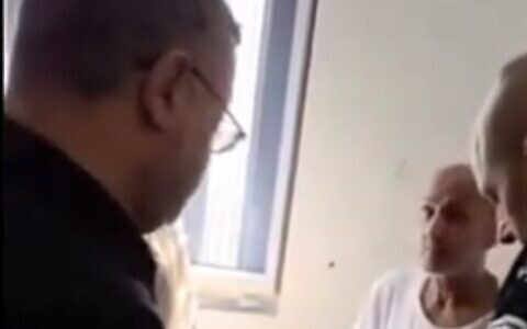 National Security Minister Itamar Ben Gvir (left) speaks to jailed Palestinian terror convict Marwan Barghouti in his cell in footage released on August 14, 2025 (X screenshot; used in accordance with clause 27a of the copyright law)