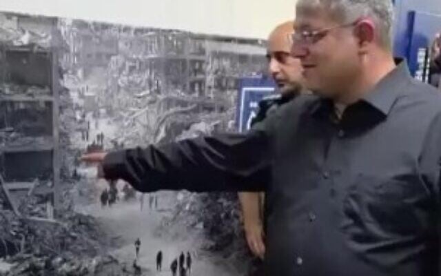 National Security Minister Itamar Ben Gvir unveils a large photo of destruction in Gaza that was hung for Palestinian security prisoners to see, August 20, 2025. (Screencapture/ Courtesy Office of National Security Minister Itamar Ben Gvir) National Security Minister Itamar Ben Gvir unveils a large photo of destruction in Gaza that was hung for Palestinian security prisoners to see, August 20, 2025. (Screencapture/ Courtesy Office of National Security Minister Itamar Ben Gvir)