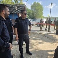 Police officers at the scene of a suspected stabbing attempt at the entrance of Kibbutz Metzer, August 2, 2025. (Israel Police)