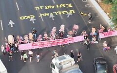 Protesters demanding a deal to free hostages in Gaza block Tel Aviv's Ayalon Highway and hold a banner reading, "Abandoning the hostages = the destruction of the Third Temple. Bring them home. Get out of Gaza," on August 3, 2025. (Aviv Atlas/Pro-Democracy Protest Movement)