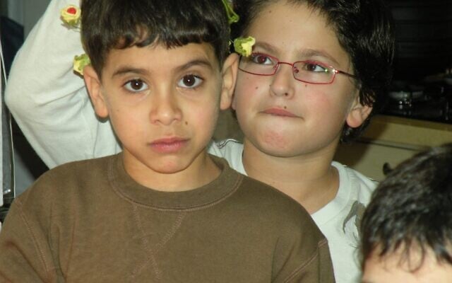 Evyatar David, left, and his cousin, Matan Eshet, when they were children, years before David was taken hostage on October 7, 2023 (Courtesy) Evyatar David, left, and his cousin, Matan Eshet, when they were children, years before David was taken hostage on October 7, 2023 (Courtesy)