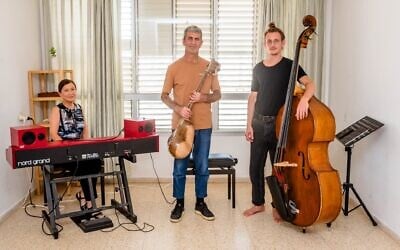 Musician Piris Eliyahu, center, will play with his trio, wife Larissa Eliyahu, left, and double bass player Daniel Avrin, in their new work, 'Advat,' on August 21, 2025 (Courtesy)