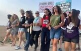 Leaders of a new movement of mothers and women to stop the war in Gaza and free the remaining Israeli march at at Nahal Oz, southern Israel, before setting up a camp near Kibbutz Sa'ad, August 10, 2025. (Naama Zeevi Rivlin)