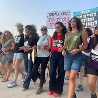 Leaders of a new movement of mothers and women to stop the war in Gaza and free the remaining Israeli march at at Nahal Oz, southern Israel, before setting up a camp near Kibbutz Sa'ad, August 10, 2025. (Naama Zeevi Rivlin)