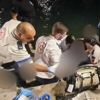 Paramedics provide first aid to a person injured by a boat propeller off the coast of Jaffa on August 16, 2025. (Magen David Adom)