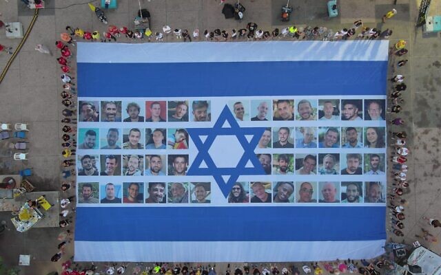A giant Israeli flag emblazoned with the faces of the hostages is displayed at Hostages Square in Tel Aviv, as a national strike gets underway, on August 17, 2025. (Yair Palti/Hostages and Missing Families Forum)