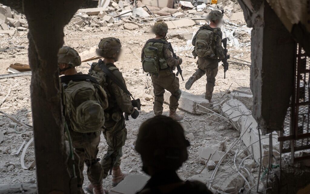 Troops of the Kfir Brigade operate in southern Gaza's Khan Younis in a handout photo issued by the IDF on August 21, 2025. (Israel Defense Forces)