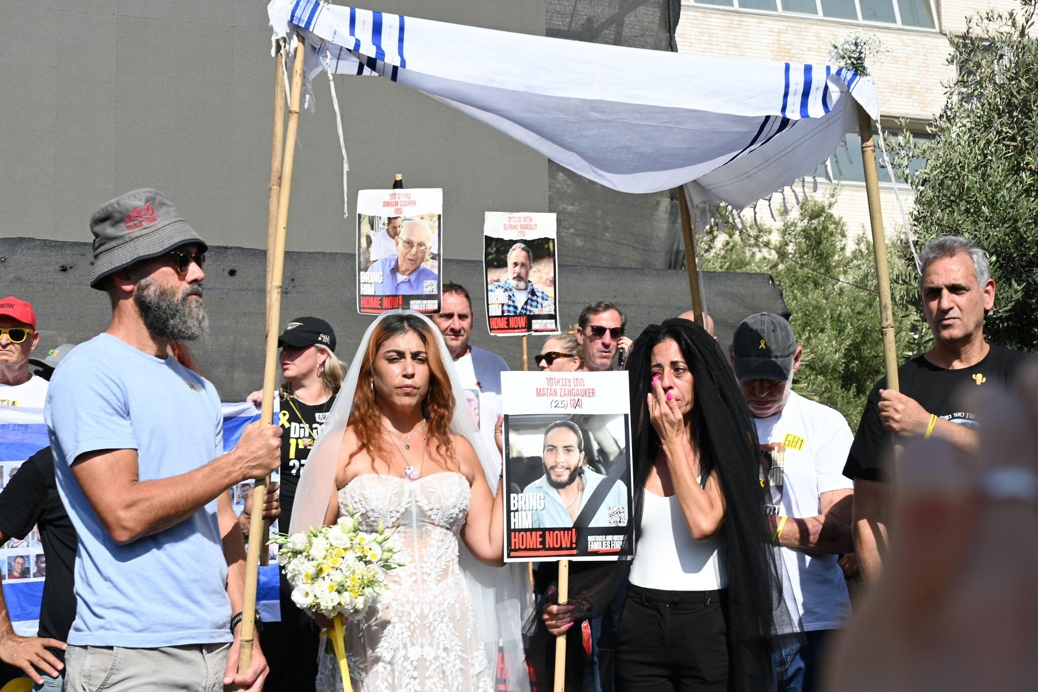 NextImg:Families stage mock wedding for hostage Matan Zangauker and ex-captive partner