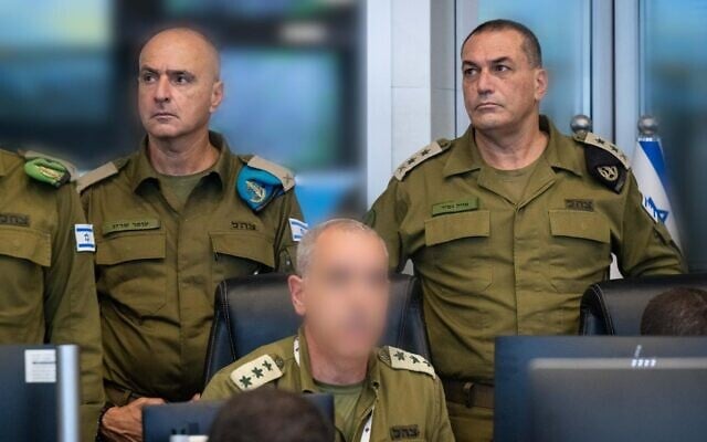 IDF Chief of Staff Lt. Gen. Eyal Zamir (left)  and  IDF Comptroller Brig. Gen. (res.) Ofer Sarig are seen at the Operations Directorate's headquarters during a military drill, August 10, 2025. (Israel Defense Forces)