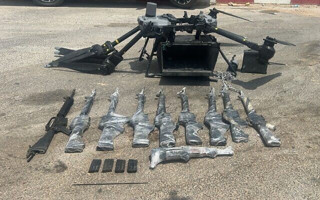 Weapons and a drone that were seized by IDF troops following an attempted smuggling on the Egyptian border, August 10, 2025. (Israel Defense Forces)
