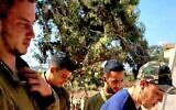 (L-R) Omer Neutra, Oz Daniel, Nimrod Cohen and Tsipora Halfon, the volunteer chair of the Association for the Welfare of Israeli Soldiers, in footage taken at the so-called 'White House' IDF post next to Kibbutz Nirim days before the former three were attacked and taken hostage on October 7, 2023, with Neutra and Daniel killed. (Screenshot: Tsipora Halfon/courtesy)