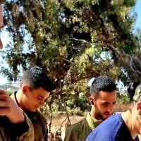(L-R) Omer Neutra, Oz Daniel, Nimrod Cohen and Tsipora Halfon, the volunteer chair of the Association for the Welfare of Israeli Soldiers, in footage taken at the so-called 'White House' IDF post next to Kibbutz Nirim days before the former three were attacked and taken hostage on October 7, 2023, with Neutra and Daniel killed. (Screenshot: Tsipora Halfon/courtesy)