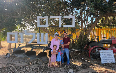 The Raisch family on new home ground in Kibbutz Kerem Shalom, close to the Gaza and Egyptian borders, September 1, 2025. (Courtesy)