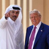 Qatar's Emir Sheikh Tamim bin Hamad Al Thani gestures next to US President Donald Trump at Al Udeid Air Base, May 15, 2025, in Doha, Qatar. (AP/Alex Brandon)