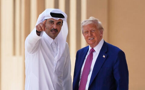 Qatar's Emir Sheikh Tamim bin Hamad Al Thani gestures next to US President Donald Trump at Al Udeid Air Base, May 15, 2025, in Doha, Qatar. (AP/Alex Brandon)