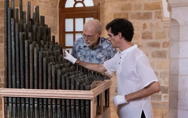 Dr. David Catalunya, a researcher at the Complutense Institute of Musical Sciences (ICCMU) in Madrid, and organ expert Koos van de Linde, with the ‘Oldest organ in Christendom,’ dating back to the 11th century, which was unveiled to the public at the Saint Savior’s Monastery of Jerusalem’s Old City on September 9, 2025. (CTS)