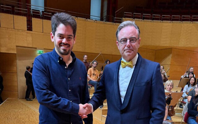Belgium’s Prime Minister Bart De Wever (R) poses with Israeli conductor Lahav Shani (L) following his performance with a philharmonic orchestra in Essen, Germany, September 13, 2025. (Bart De Wever via X)