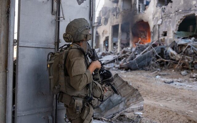 IDF troops operate in Gaza City, in a handout photo issued on September 17, 2025. (Israel Defense Forces)