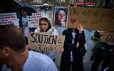 Protesters rally for the release of French teacher Cecile Kohler and her partner Jacques Paris from Iranian prison, at Place de la Republique in Paris, France, on March 23, 2024. (Kiran RIDLEY / AFP)