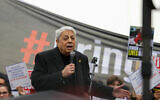 French singer and songwriter Enrico Macias addresses the audience during a gathering organized by the Representative Council of Jewish Institutions of France (CRIF) calling for the release of the hostages held in Gaza since the Hamas-led October 7 attacks on Israel, at the Trocadeo esplanade in Paris, on April 7, 2024 (Thomas SAMSON / AFP)
