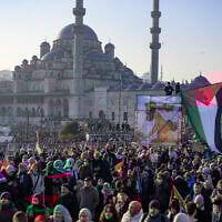 Demonstrators attend a pro-Palestinian, anti-Israel rally at the Galata Bridge in Istanbul on January 1, 2025. (Photo by Yasin AKGUL / AFP)