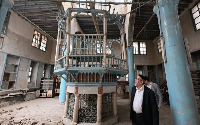 US-based Syrian rabbi Youssef Hamra tours the Ifrange Synagogue in the Jewish quarter of Damascus's Bab Sharqi district, on February 19, 2025. (LOUAI BESHARA / AFP)