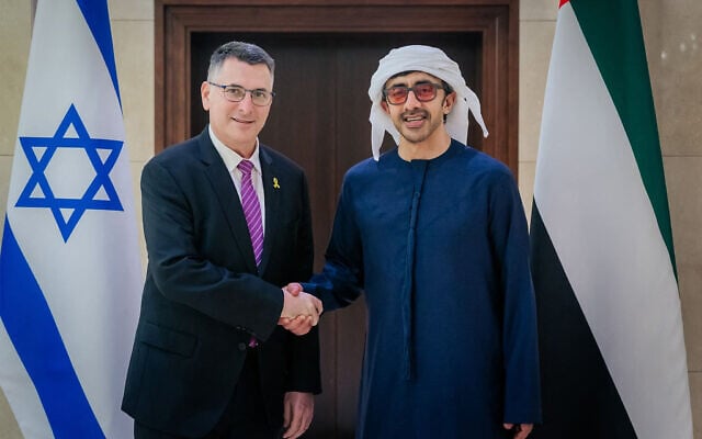 This handout image provided by United Arab Emirates News Agency (WAM) shows the UAE's Foreign Minister Abdullah bin Zayed al-Nahyan (R) receiving Israel's Foreign Minister Gideon Saar in Abu Dhabi on April 6, 2025.  (Photo by WAM / AFP)