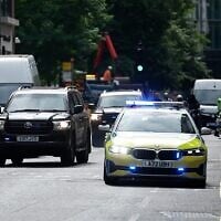 A prison van under police escort arrives to the Old Bailey criminal court in London on May 30, 2025. (Benjamin Cremel / AFP)