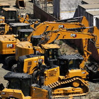 In an aerial view, Caterpillar equipment sits parked in a lot at Peterson Cat on August 5, 2025 in San Leandro, California. (JUSTIN SULLIVAN / Getty Images via AFP)