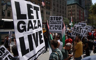 People gather during the "Stand with Gaza" protest at Bryant Park in New York on August 16, 2025. (Leonardo Munoz/AFP)