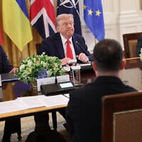 US President Donald Trump sits across the table from Ukrainian President Volodymyr Zelensky (lower right), as French President Emmanuel Macron and Italian Prime Minister Giorgia Meloni sit next to Trump during a meeting with European leaders at the White House on August 18, 2025 in Washington, DC. (Win McNamee/Getty Images North America/Getty Images via AFP)