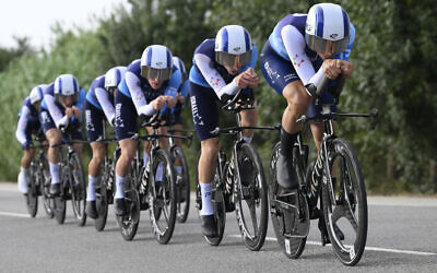 Team Israel Premier Tech's riders compete during the fifth stage of La Vuelta a Espana cycling tour, a 24.1 km time-trial team race in Figueres, on August 27, 2025. (Josep LAGO / AFP)
