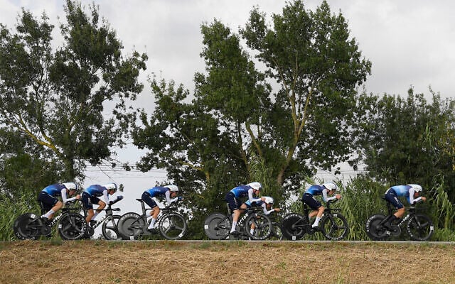 Team Israel-Premier Tech's riders compete during the fifth stage of La Vuelta a Espana cycling tour, a 24.1 kilometer time-trial team race in Figueres, on August 27, 2025. (Josep Lago/AFP)