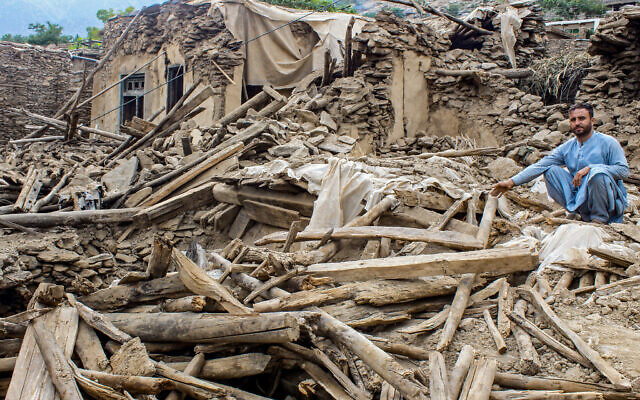 An Afghan man sits amid the remains of a damaged house, in the aftermath of an earthquake at the Dara-i-Nur district of Nangarhar province on September 3, 2025 (AFP)