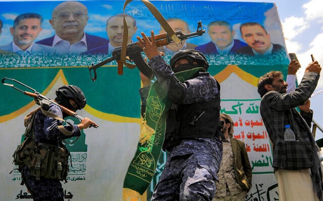 Members of security forces loyal to Yemen's Houthis perform a dance with their assault rifles during an event in Sanaa on September 3, 2025. (Mohammed HUWAIS / AFP)
