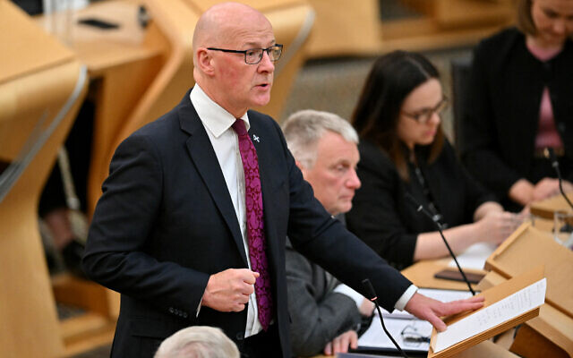 Scotland's First Minister John Swinney delivers a speech calling on the Scottish Parliament to recognise the State of Palestine, at the Scottish Government Buildings in Edinburgh, Scotland on September 3, 2025. (Photo by ANDY BUCHANAN / AFP) Scotland's First Minister John Swinney delivers a speech calling on the Scottish Parliament to recognise the State of Palestine, at the Scottish Government Buildings in Edinburgh, Scotland on September 3, 2025. (Photo by ANDY BUCHANAN / AFP)