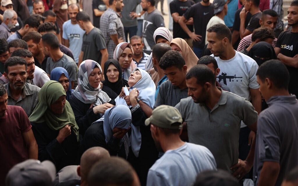A Palestinian woman reacts as the bodies of people killed in Israeli strikes on Gaza City at dawn, are brought for a funeral procession at the Al-Shifa hospital on September 4, 2025 (Omar AL-QATTAA / AFP)