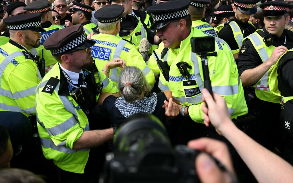 A protester is carried away by police officers at a "Lift The Ban" demonstration in support of the proscribed group Palestine Action, in Parliament Square, central London, on September 6, 2025. (JUSTIN TALLIS / AFP)