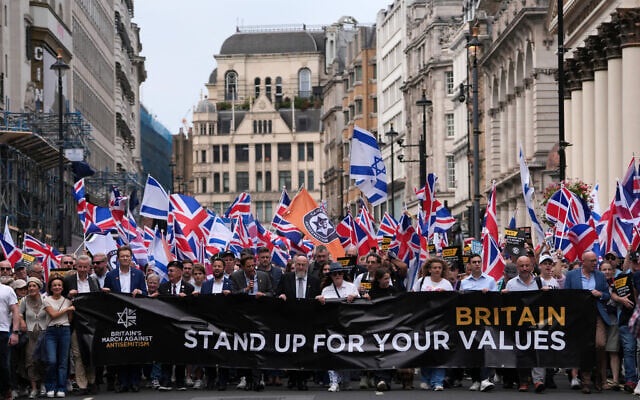 Former Conservative cabinet minister Michael Gove, Reform UK Deputy Leader Richard Tice and Chief Rabbi Ephraim Mirvis lead a 'march against antisemitism' demonstration in central London, on September 7, 2025, (Photo by CARLOS JASSO / AFP)