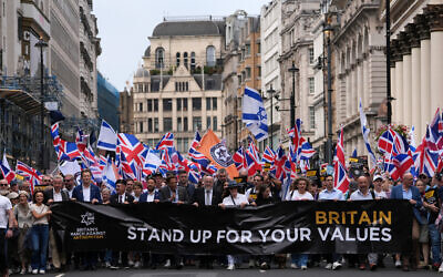 Former Conservative cabinet minister Michael Gove, Reform UK Deputy Leader Richard Tice and Chief Rabbi Ephraim Mirvis lead a 'march against antisemitism' demonstration in central London, on September 7, 2025, (Photo by CARLOS JASSO / AFP)