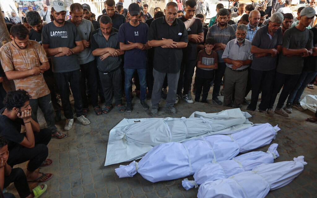 Palestinians pray by the bodies of people killed in early Israeli strikes, during their funeral at Shifa Hospital in Gaza City on September 8, 2025. (Omar AL-QATTAA / AFP) Palestinians pray by the bodies of people killed in early Israeli strikes, during their funeral at Shifa Hospital in Gaza City on September 8, 2025. (Omar AL-QATTAA / AFP)