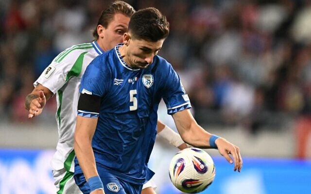 Israel's defender Idan Nachmias handles the ball during the 2026 World Cup qualifiers Europe zone group I soccer match between Israel and Italy on September 8, 2025 in Debrecen, Hungary. (Photo by Attila KISBENEDEK / AFP) Israel's defender Idan Nachmias handles the ball during the 2026 World Cup qualifiers Europe zone group I soccer match between Israel and Italy on September 8, 2025 in Debrecen, Hungary. (Photo by Attila KISBENEDEK / AFP)