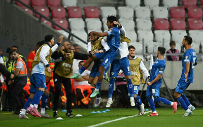 Israel's midfielder Dor Peretz (center) is celebrates with team mates after scoring to give Israel a 2-1 lead during the 2026 World Cup qualifiers Europe zone group I football match between Israel and Italy on September 8, 2025 in Debrecen, Hungary. (Attila KISBENEDEK / AFP) Israel's midfielder Dor Peretz (center) is celebrates with team mates after scoring to give Israel a 2-1 lead during the 2026 World Cup qualifiers Europe zone group I football match between Israel and Italy on September 8, 2025 in Debrecen, Hungary. (Attila KISBENEDEK / AFP)