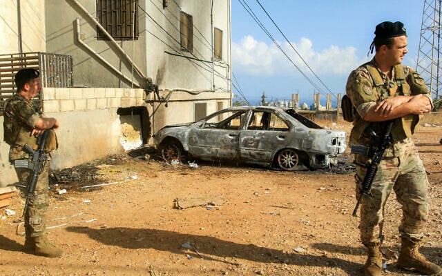 Lebanese army soldiers and security forces deploy near a vehicle that was hit by a reported drone-strike at the entrance of the village of Barja, about 30 kilometres south of Beirut, on September 9, 2025. (Mahmoud ZAYYAT / AFP) Lebanese army soldiers and security forces deploy near a vehicle that was hit by a reported drone-strike at the entrance of the village of Barja, about 30 kilometres south of Beirut, on September 9, 2025. (Mahmoud ZAYYAT / AFP)