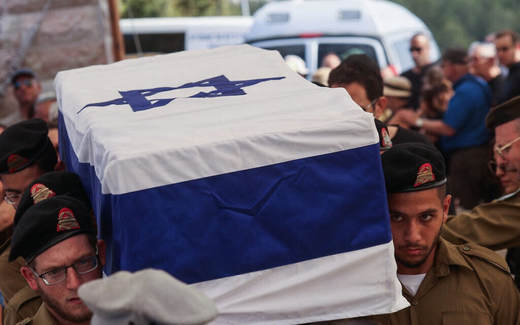 Israeli troops carry the coffin of fellow soldier Amit Arye Regev who was killed a day earlier in the war in the Gaza Strip, during his funeral at the military cemetery in the central city of Modiin on September 9, 2025. (Photo by GIL COHEN-MAGEN / AFP)