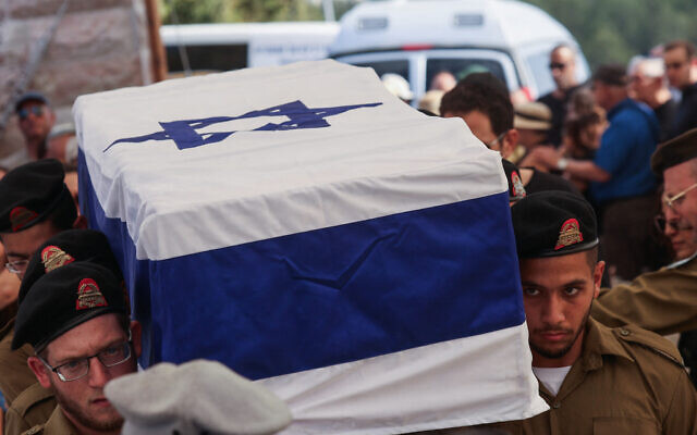 Israeli troops carry the coffin of fellow soldier Amit Arye Regev who was killed a day earlier in the war in the Gaza Strip, during his funeral at the military cemetery in the central city of Modiin on September 9, 2025. (Photo by GIL COHEN-MAGEN / AFP)